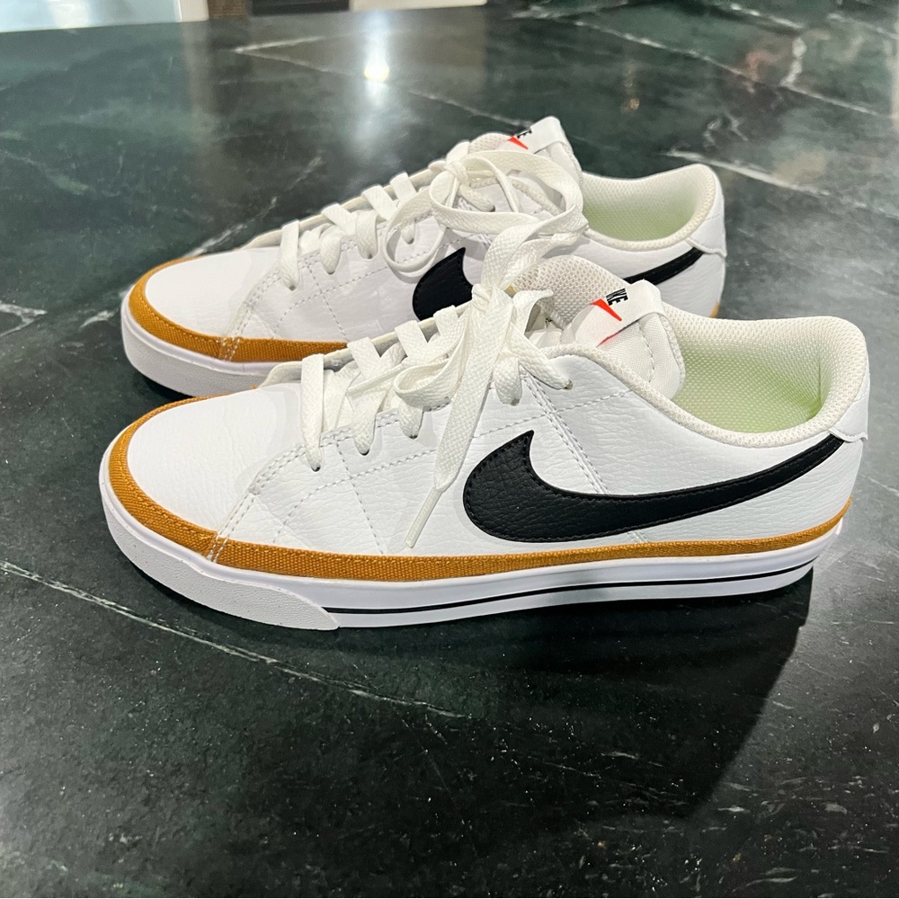 Nike White Sneakers with Gold and Black Accents